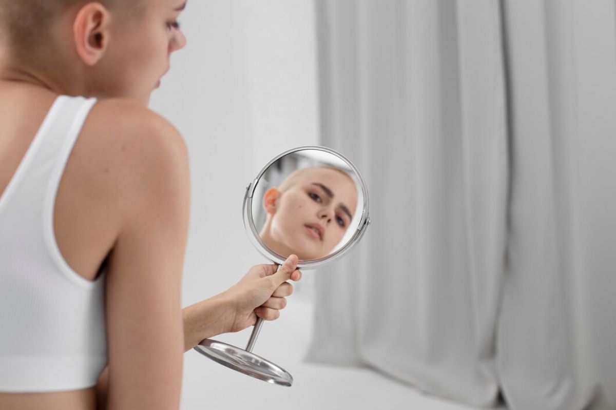 young-woman-with-eating-disorder-checking-herself-mirror_23-2149168778